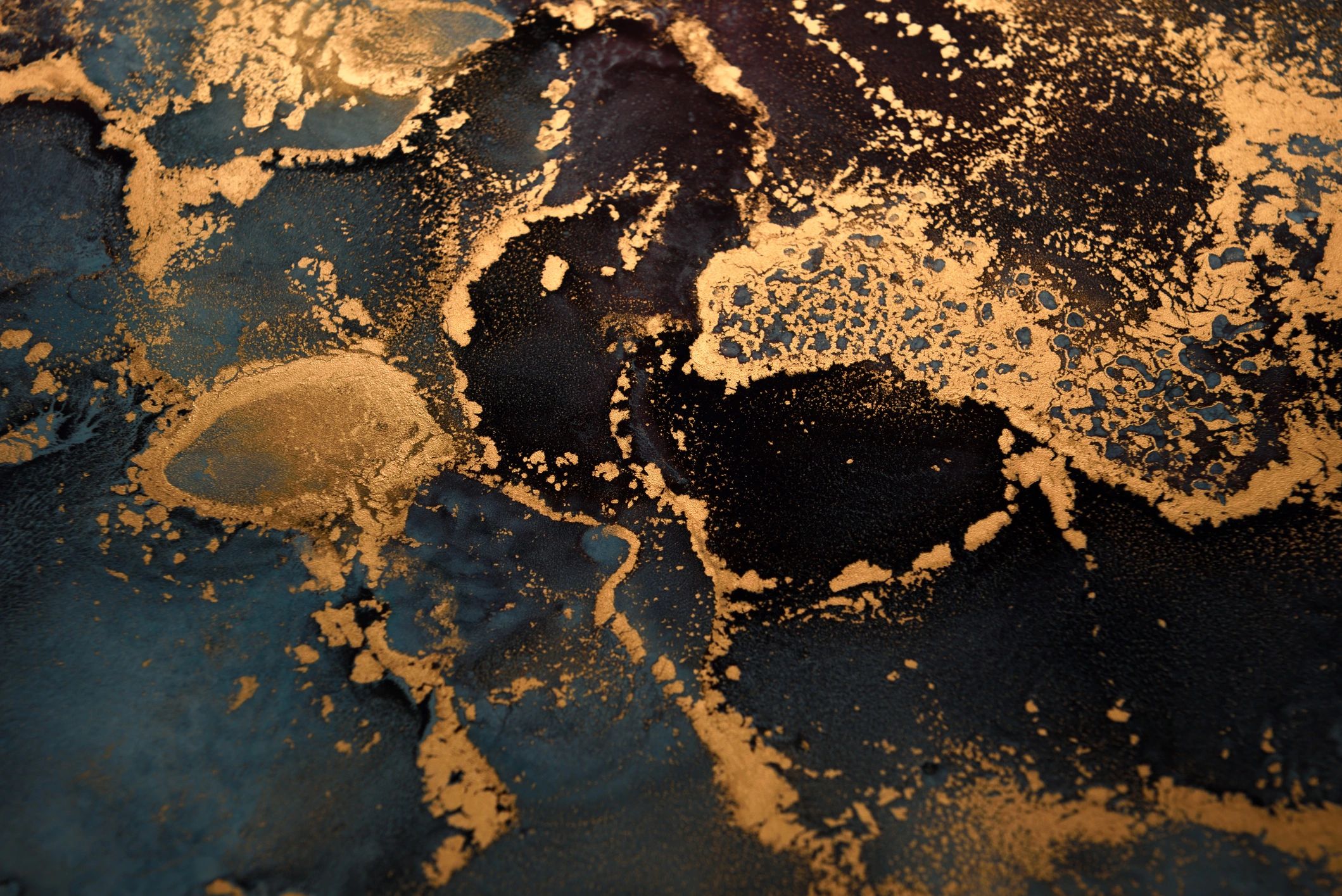 Abstract artwork with blue-gray swirls and gold accents